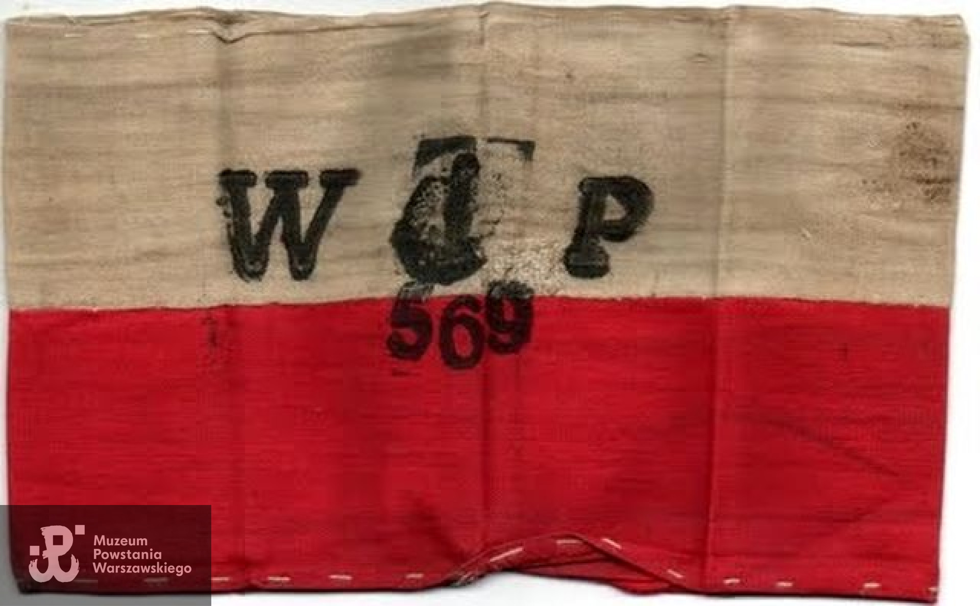 Powstańcza opaska należąca do Zdzisława Łęckiego ps. "Benet". Ze zbiorów Andrzeja Łęckiego/Archiwum 2. HBAP "Żbik"