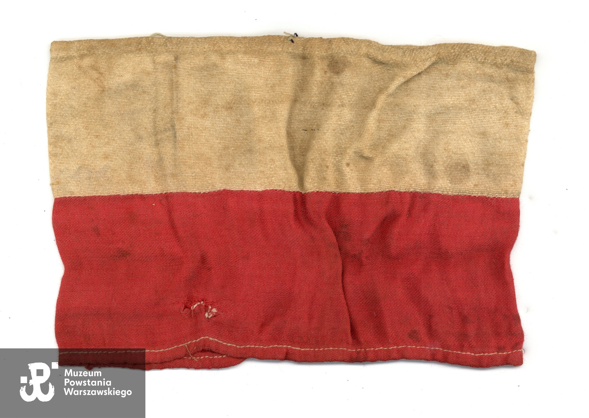 Opaska powstańcza Zbigniewa Feliksa Markowskiego ps. Grey - awers. Ze zbiorów rodzinnych p. Bartosza Markowskiego, wnuka Powstańca. 