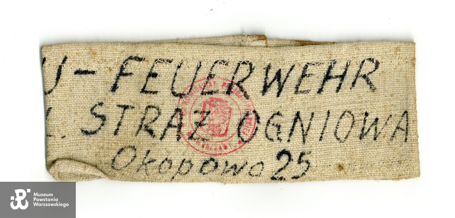 Należąca do Stefana Czyżewskiego  opaska OPL z napisem <i>LU - FEUERWEHR, OPL - STRAŻ OGNIOWA, Okopowa 25</i> i numerem 12. Zbiory rodzinne, udostępniła p. Kinga Rusin, wnuczka Powstańca.