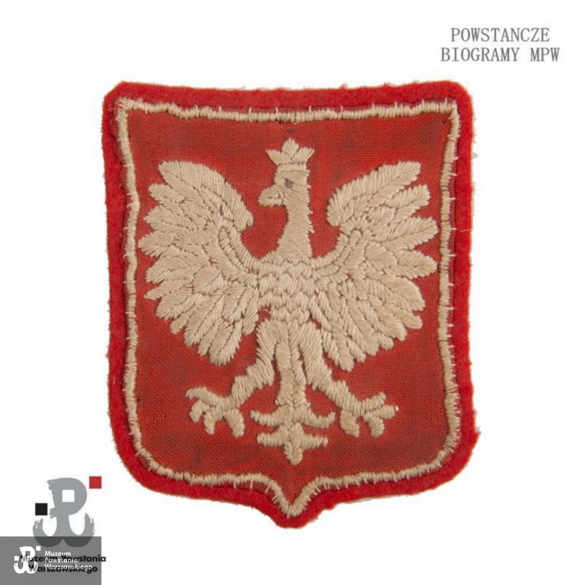 Należący do Zofii Arcimowicz  orzełek wyszyty przez nią podczas pobytu w Stalagu 344 Lamsdorf na kawałku materiału pochodzącego z poduszki. <ul> Ze zbiorów MPW - ekspozycja stała</ul>