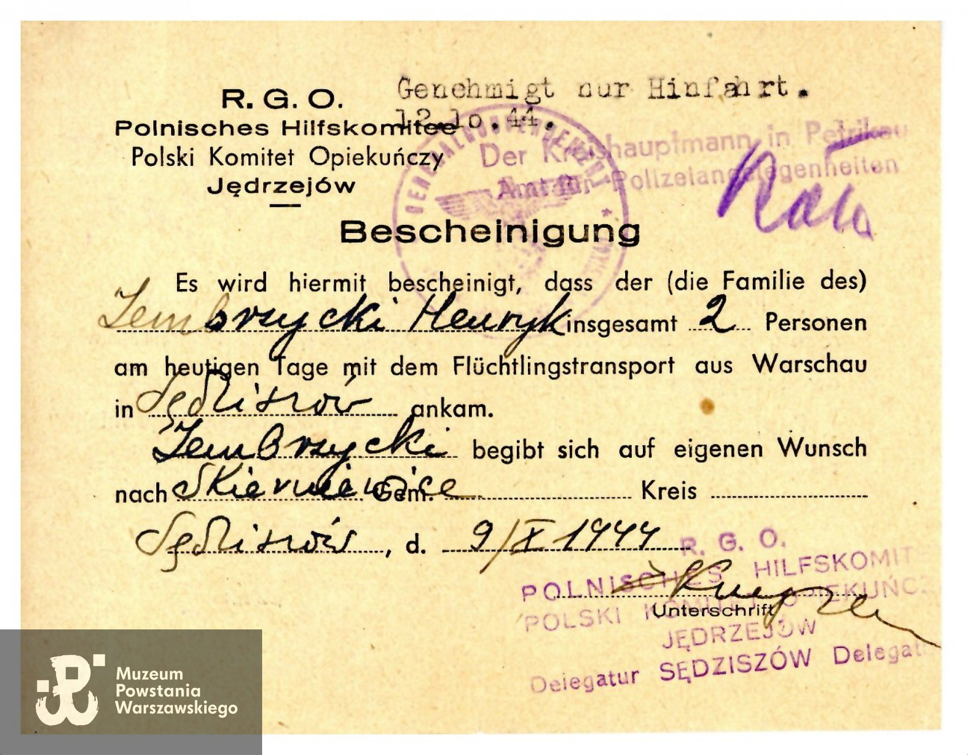 Zaświadczenie  (niem. Bescheinigung) wystawione przez RGO w Jędrzejowie dla przybyłego transportem z Warszawy Henryka Zembrzyckiego. Dokument w języku polskim i języku niemieckim. Ze zbiorów Muzeum Powstania Warszawskiego, sygn. MPW-A-8232