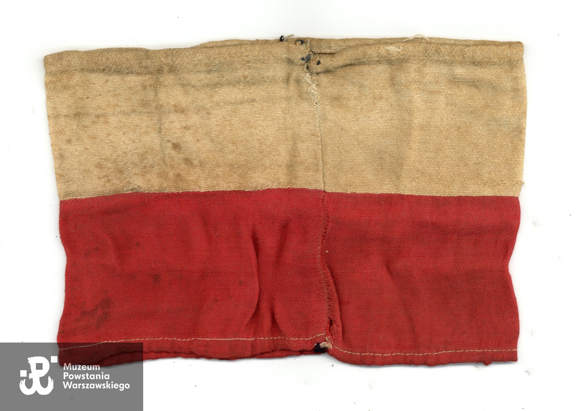 Opaska powstańcza Zbigniewa Feliksa Markowskiego ps. Grey - rewers. Ze zbiorów rodzinnych p. Bartosza Markowskiego, wnuka Powstańca. 