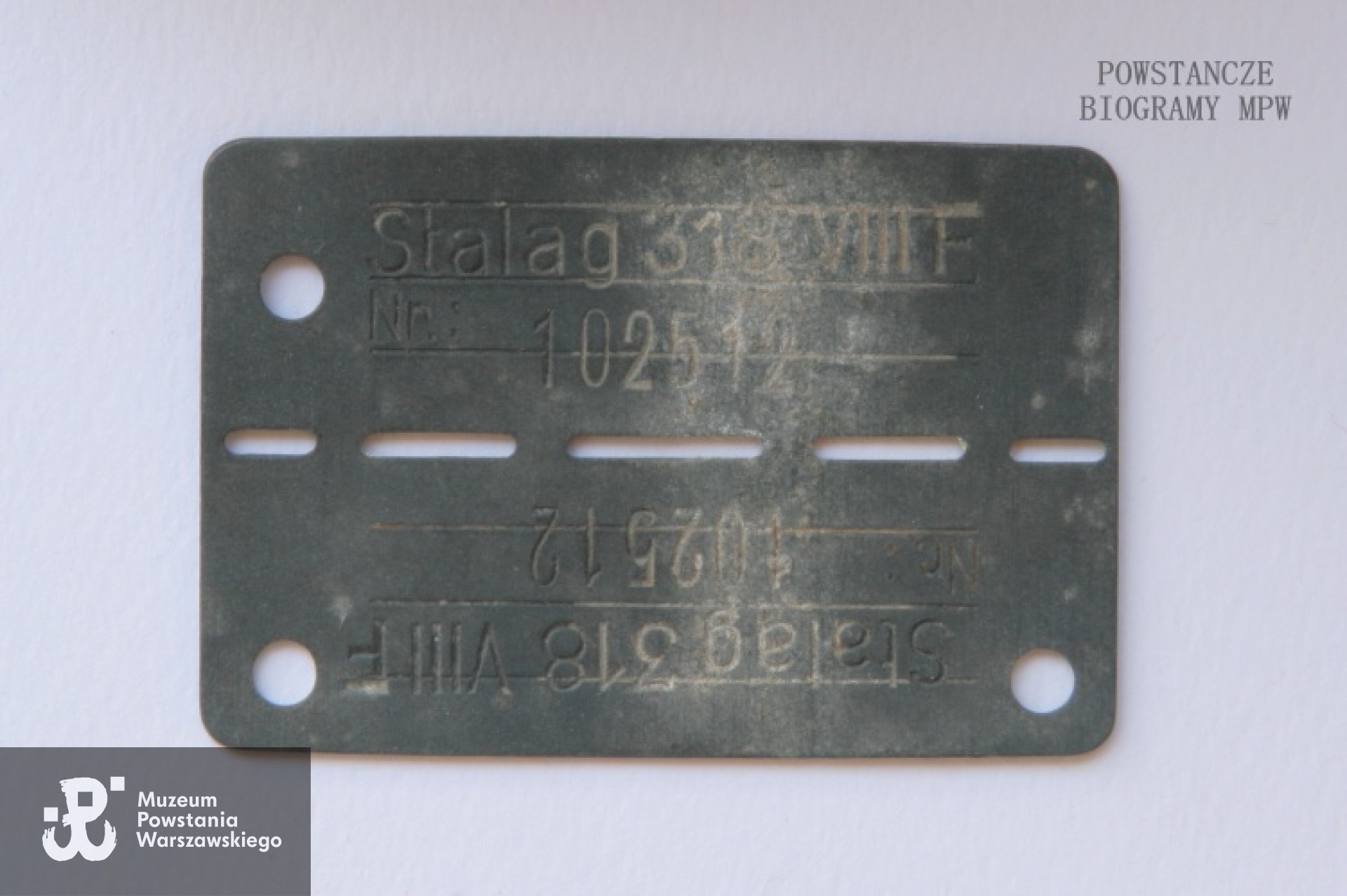 Blaszka jeniecka ze Stalagu 318 VIII F / 344 Lamsdorf - numer obozowy 102512. Z archiwum rodzinnego córki