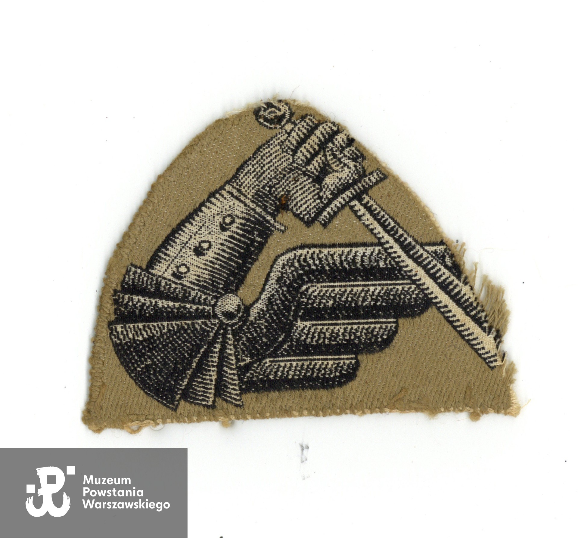 Należąca do Zbigniewa Feliksa Markowskiego ps. Grey naszywka 2. Warszawskiej Dywizji Pancernej Polskich Sił Zbrojnych na Zachodzie.  Ze zbiorów rodzinnych p. Bartosza Markowskiego, wnuka Powstańca. 