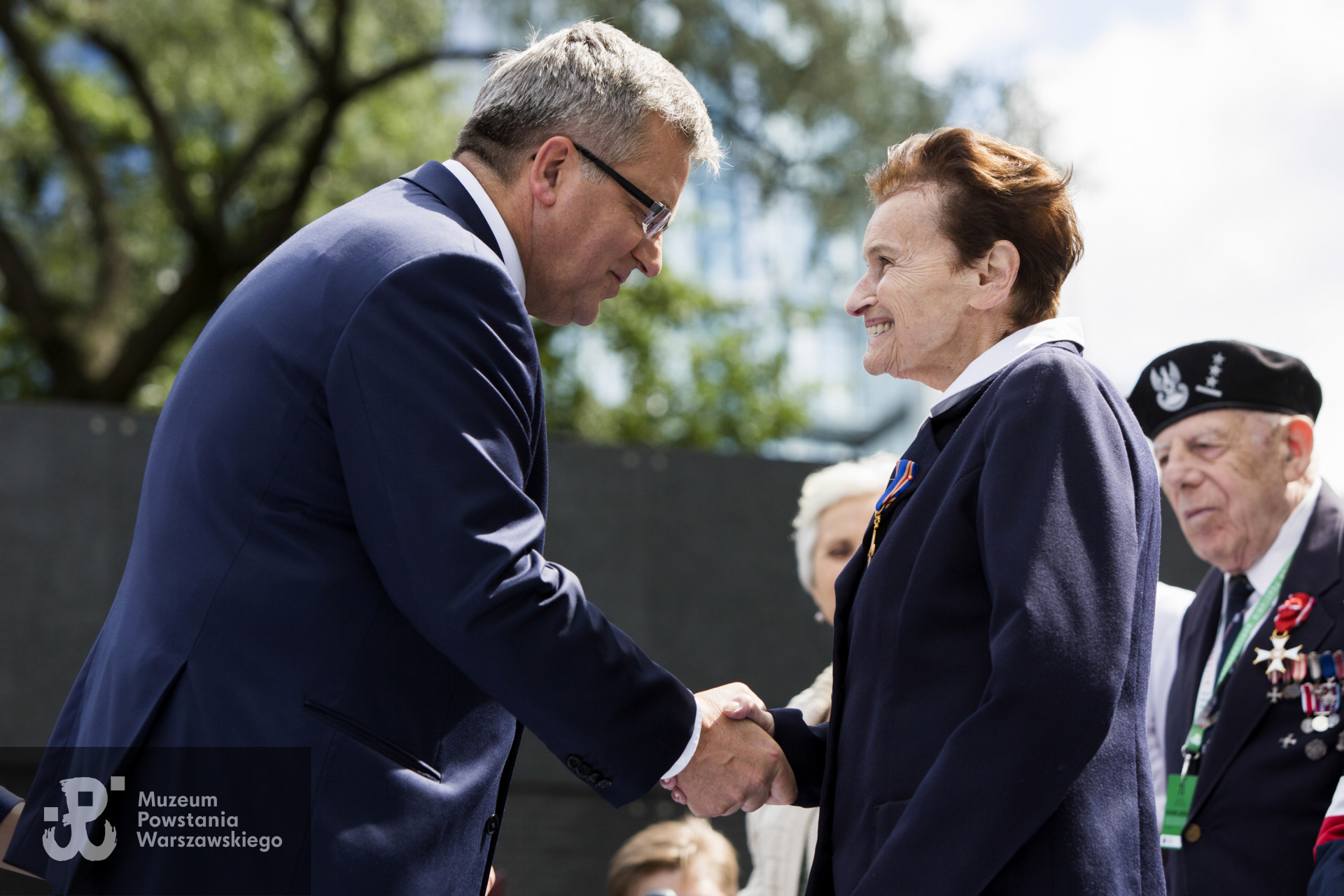 Maria Milbrandt z d. Bryner podczas uroczystości odebrania z rąk Prezydenta RP Krzyża Orderu Krzyża Niepodległości. Fotografie wykonane na potrzeby oficjalnego serwisu  Prezydenta Rzeczypospolitej Polskiej, kopia ze zbiorów rodzinnych. 