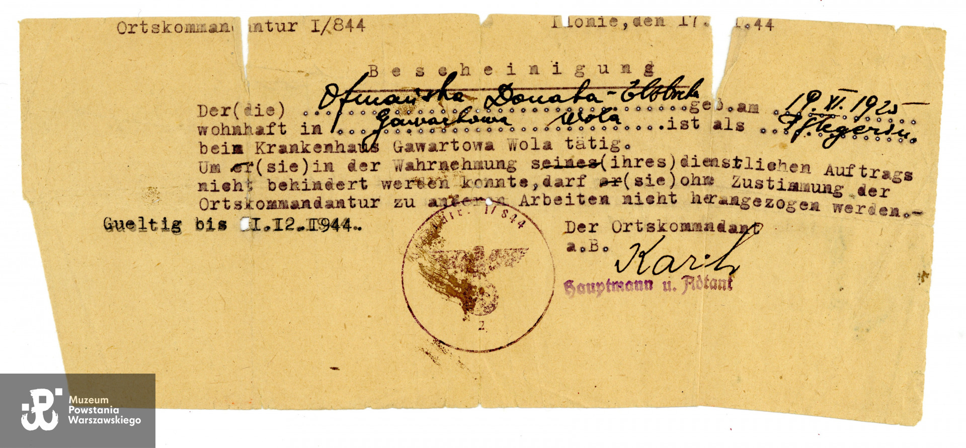 Zaświadczenie (Bescheinigung) wystawione na nazwisko Donata Elżbieta Ofmańska. Dokument w jęz. niemieckim, data częściowo nieczytelna. Ze zbiorów Muzeum Powstania Warszawskiego, sygn. P/9735/23